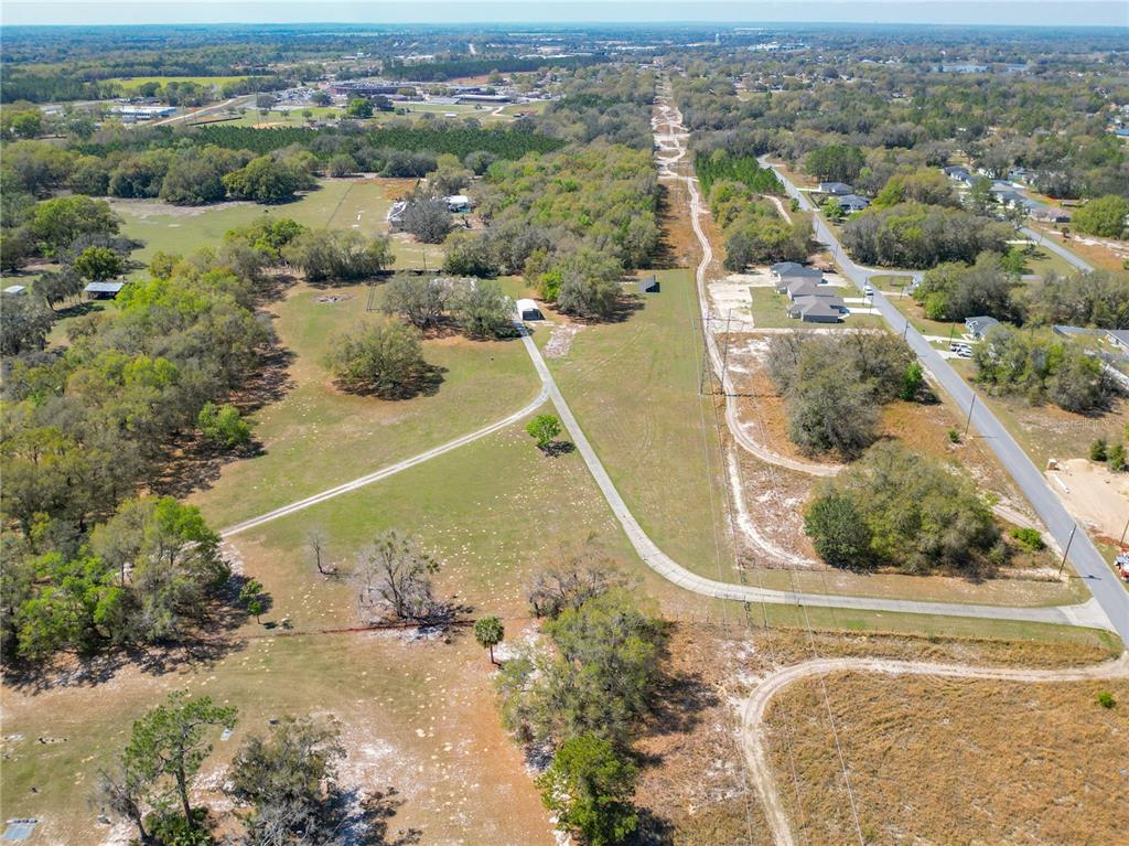 295 Locust Pass Ocala, FL 34472 - Photo 38 of 62 an aerial view of residential houses with outdoor space