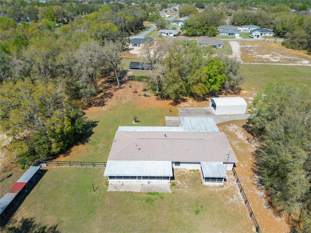 295 Locust Pass Ocala, FL 34472 - Photo 42 of 62 an aerial view of residential houses with outdoor space