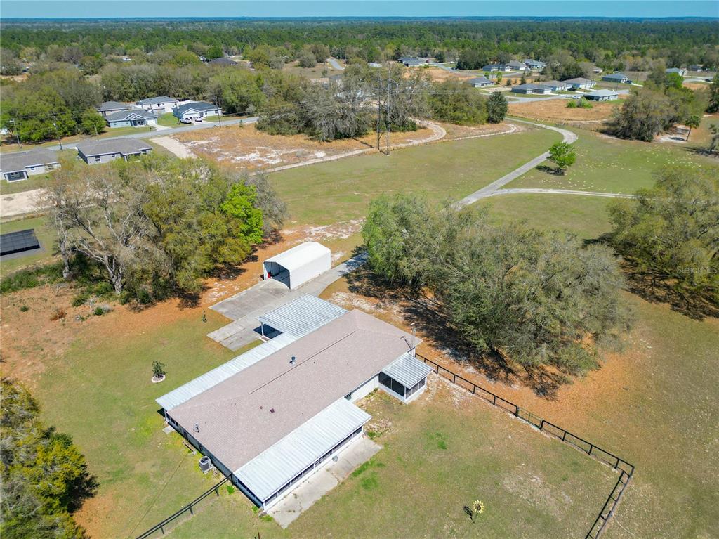 295 Locust Pass Ocala, FL 34472 - Photo 43 of 62 an aerial view of residential houses with outdoor space