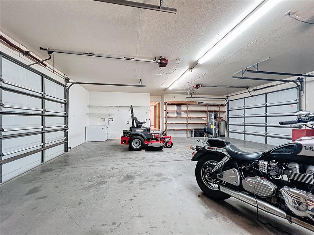 295 Locust Pass Ocala, FL 34472 - Photo 46 of 62 a view of a garage with parked cars
