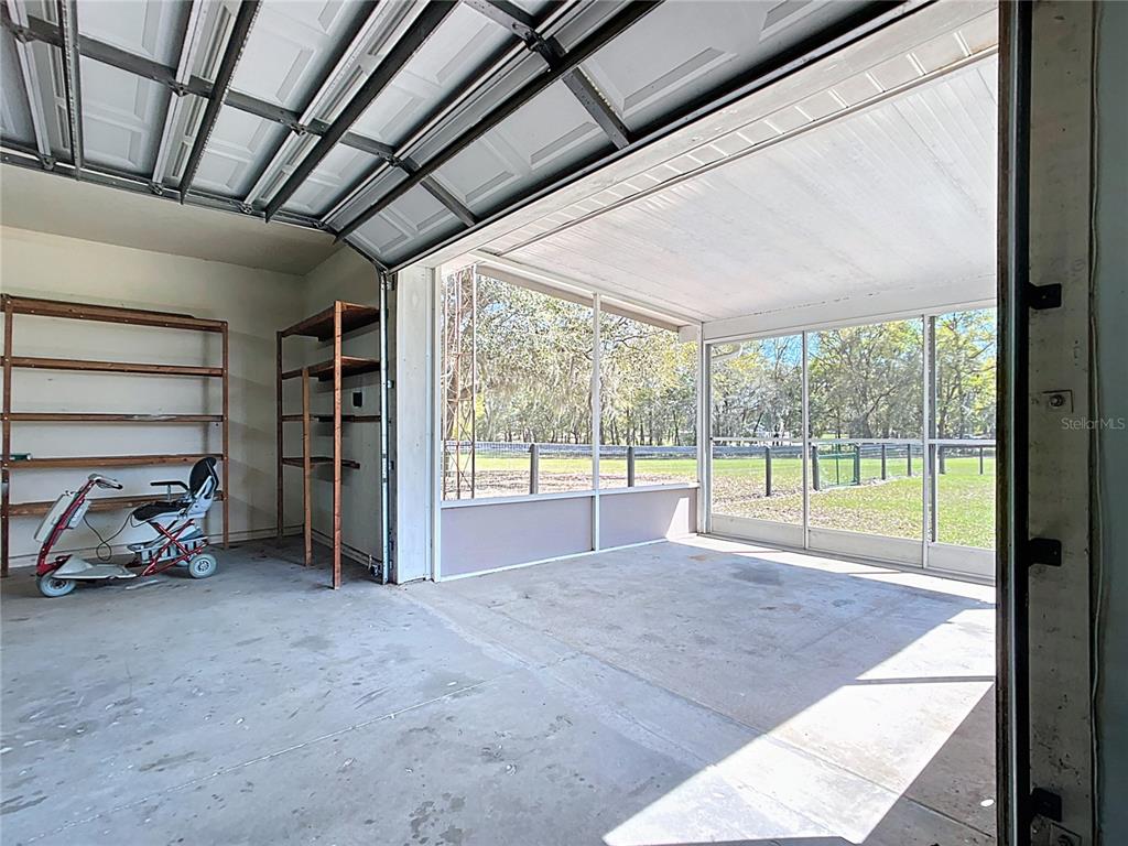 295 Locust Pass Ocala, FL 34472 - Photo 49 of 62 a view of a room with gym equipment and a large window