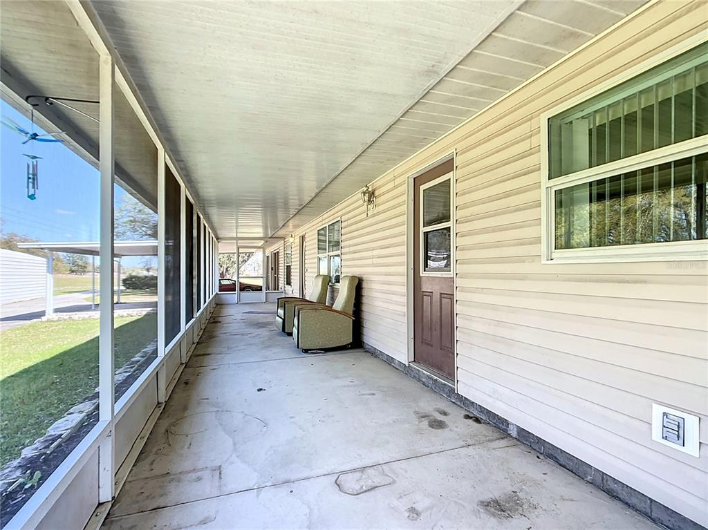 295 Locust Pass Ocala, FL 34472 - Photo 52 of 62 a view of a porch with furniture