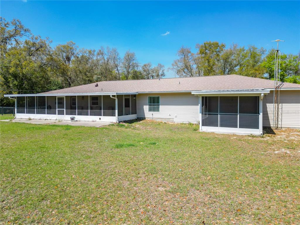 295 Locust Pass Ocala, FL 34472 - Photo 54 of 62 a front view of a house with a yard