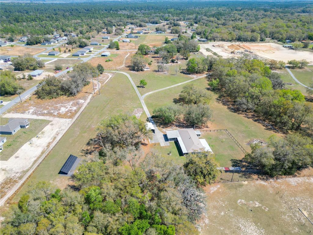 295 Locust Pass Ocala, FL 34472 - Photo 61 of 62 an aerial view of residential houses with outdoor space