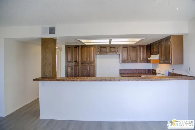 a view of kitchen with cabinets