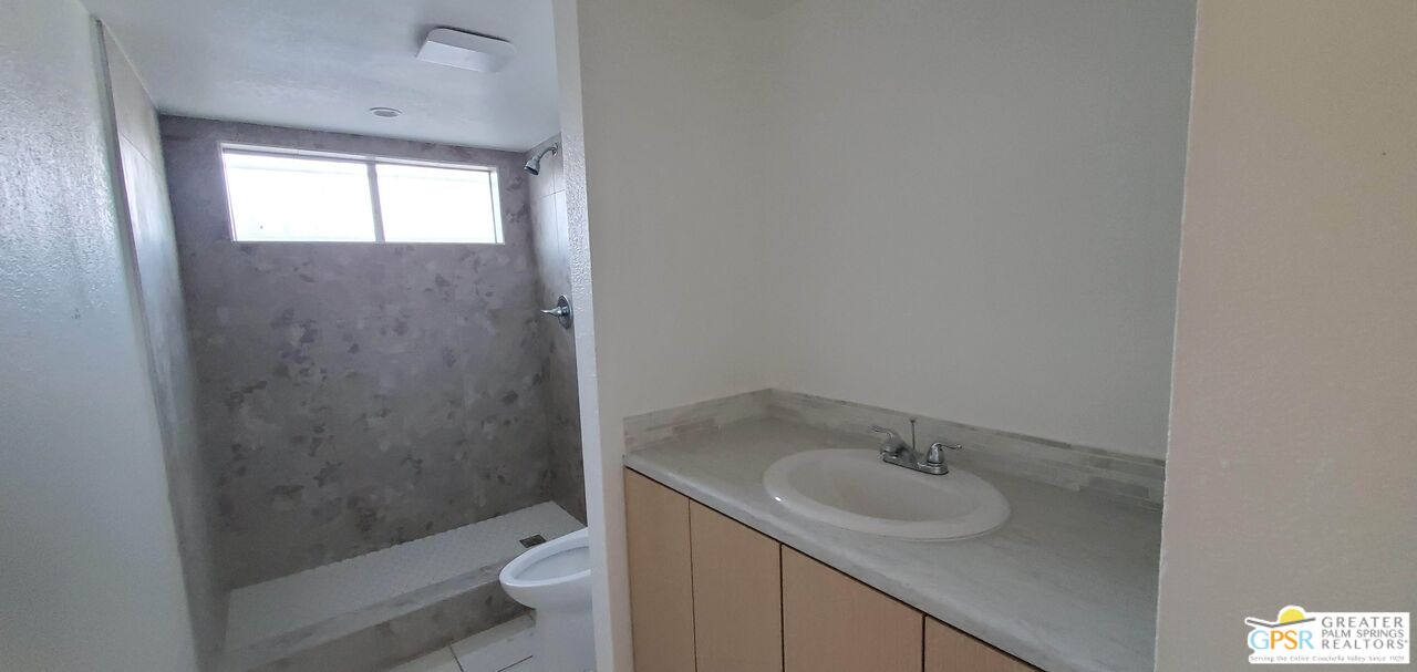 66565 12th Street, Unit 1 Desert Hot Springs, CA 92240 - Photo 4 of 10 a bathroom with a sink toilet and shower