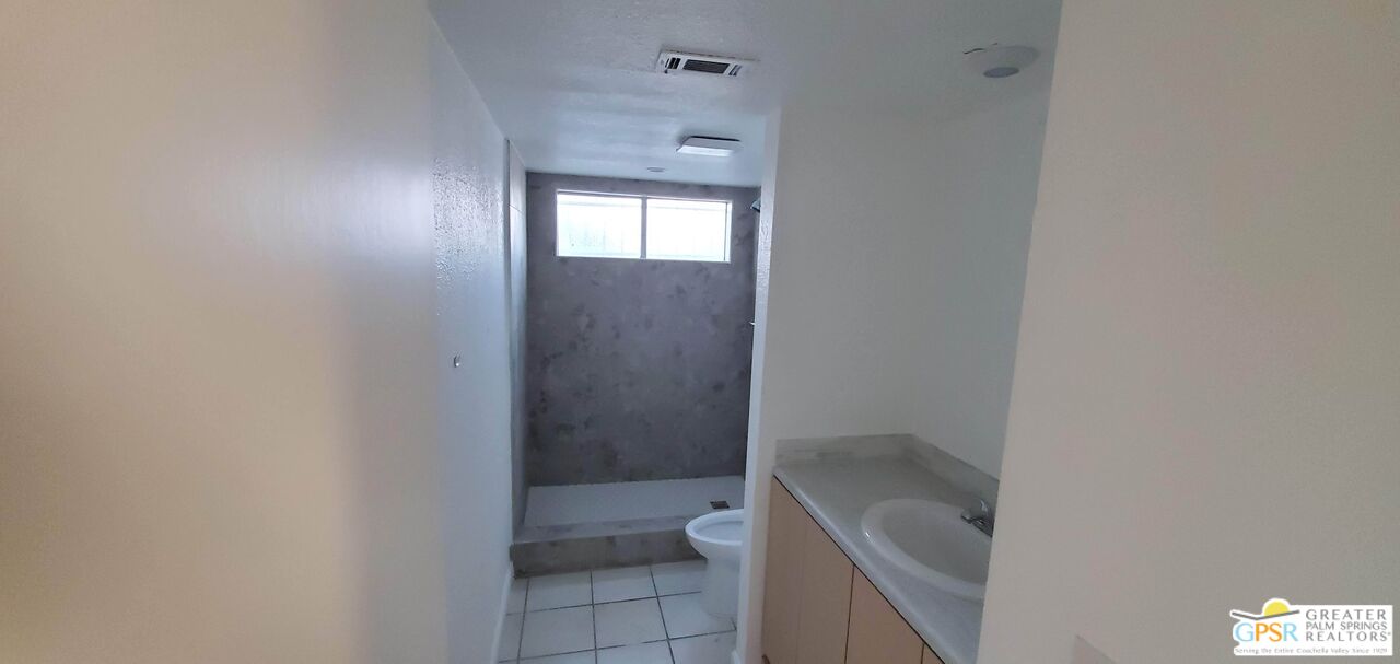 66565 12th Street, Unit 1 Desert Hot Springs, CA 92240 - Photo 5 of 10 a bathroom with a tub shower and sink