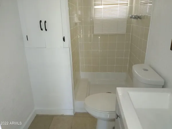 a bench sitting in front of house