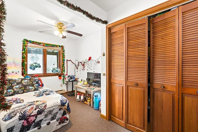 a bedroom with furniture and a window