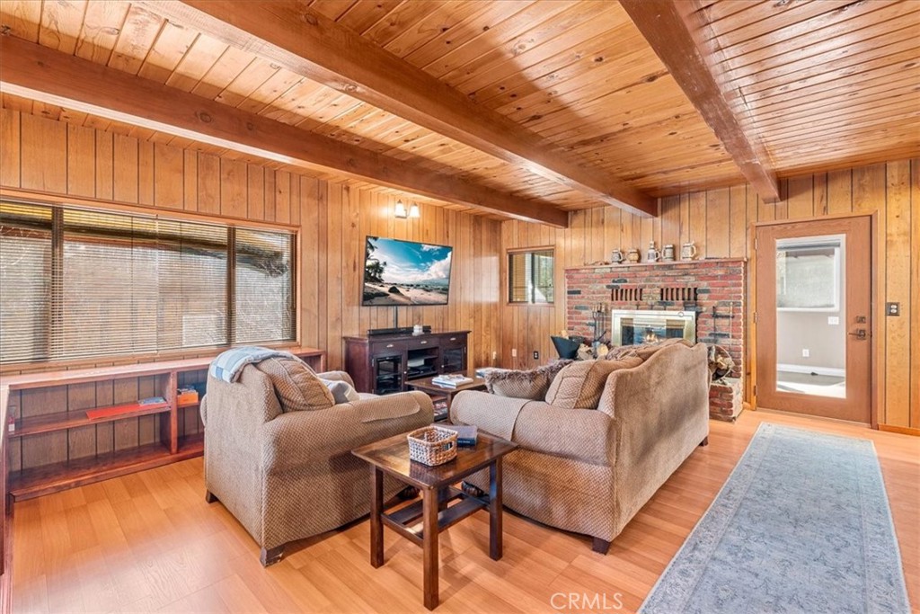 1631 Linnet Road Wrightwood, CA 92397 - Photo 11 of 42 a living room with furniture and a large window