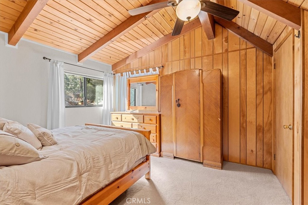 1631 Linnet Road Wrightwood, CA 92397 - Photo 28 of 42 a bedroom with a bed a window and shower