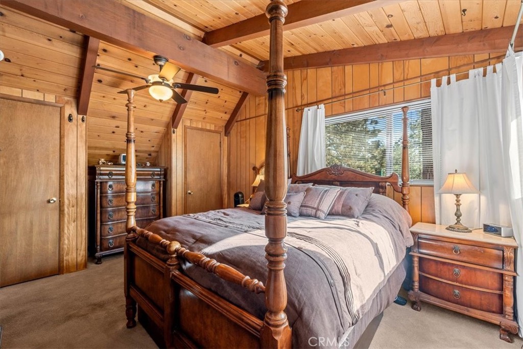 1631 Linnet Road Wrightwood, CA 92397 - Photo 32 of 42 a bed sitting in a bedroom next to a window