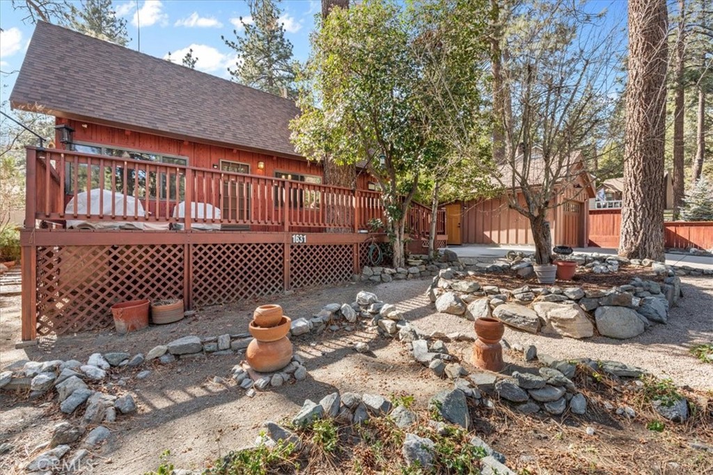 1631 Linnet Road Wrightwood, CA 92397 - Photo 4 of 42 a backyard of a house with outdoor seating