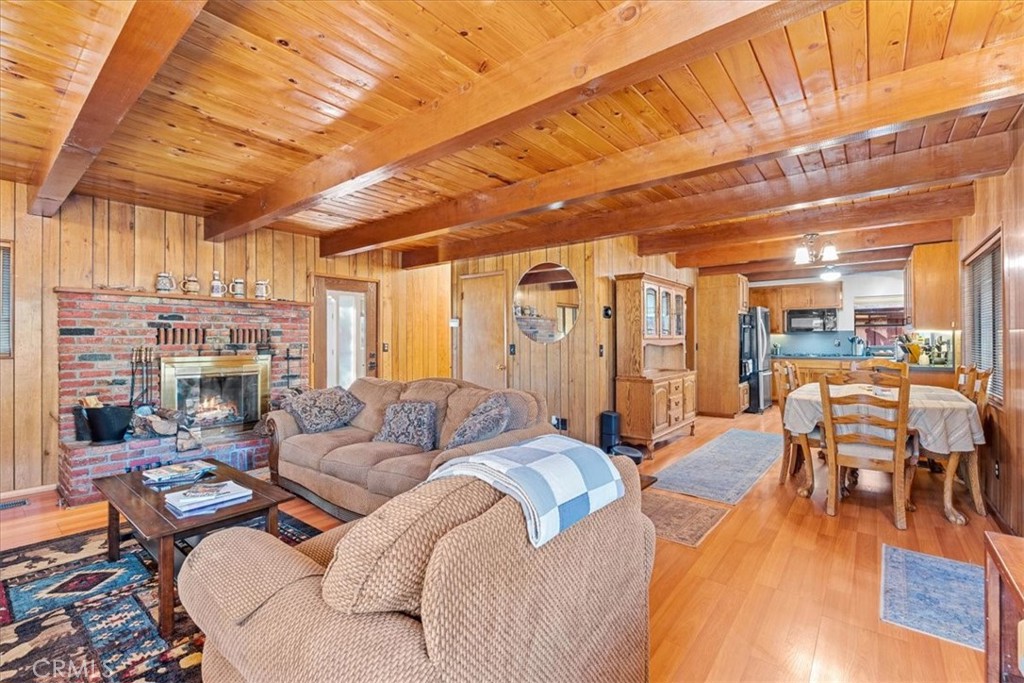 1631 Linnet Road Wrightwood, CA 92397 - Photo 9 of 42 a living room with furniture and a wooden floor