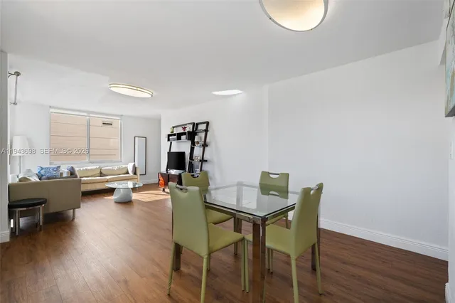 a view of a livingroom with furniture and a wooden floor