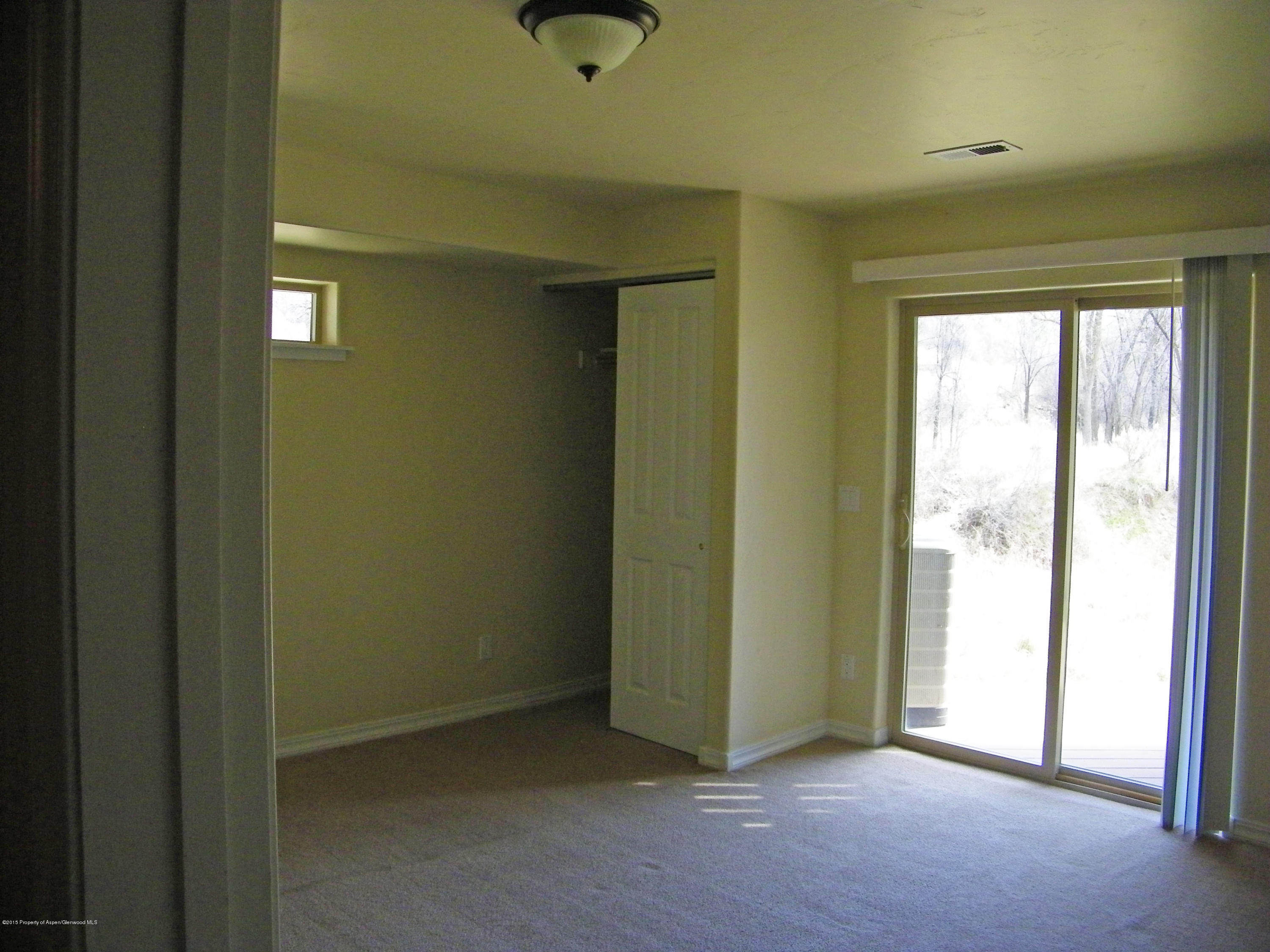 1018 East Avenue, Unit 5 Rifle, CO 81650 - Photo 7 of 8 rec room-bedroom.JPG