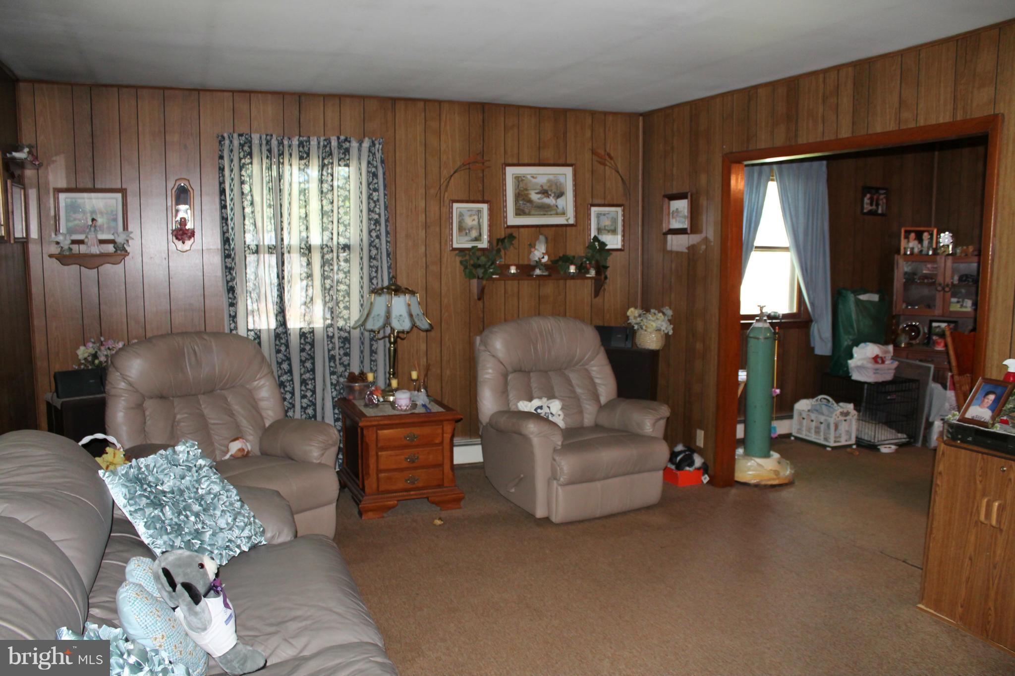 2335 Poplar Road Baltimore, MD 21221 - Photo 4 of 15 a living room with furniture and a large window