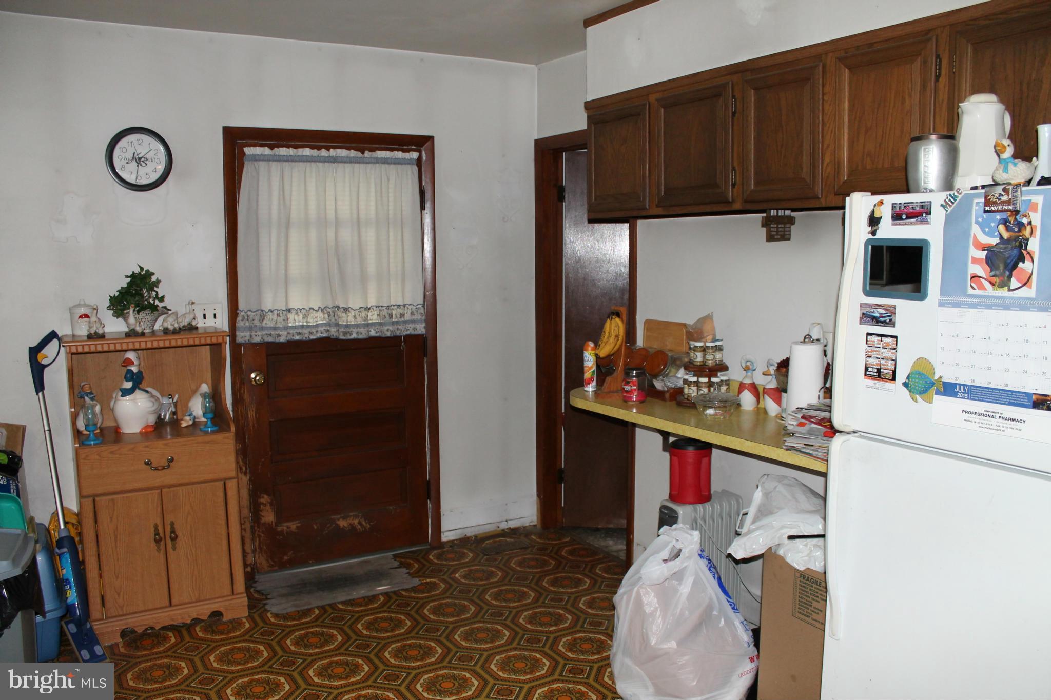 2335 Poplar Road Baltimore, MD 21221 - Photo 6 of 15 a kitchen with a sink and cabinets