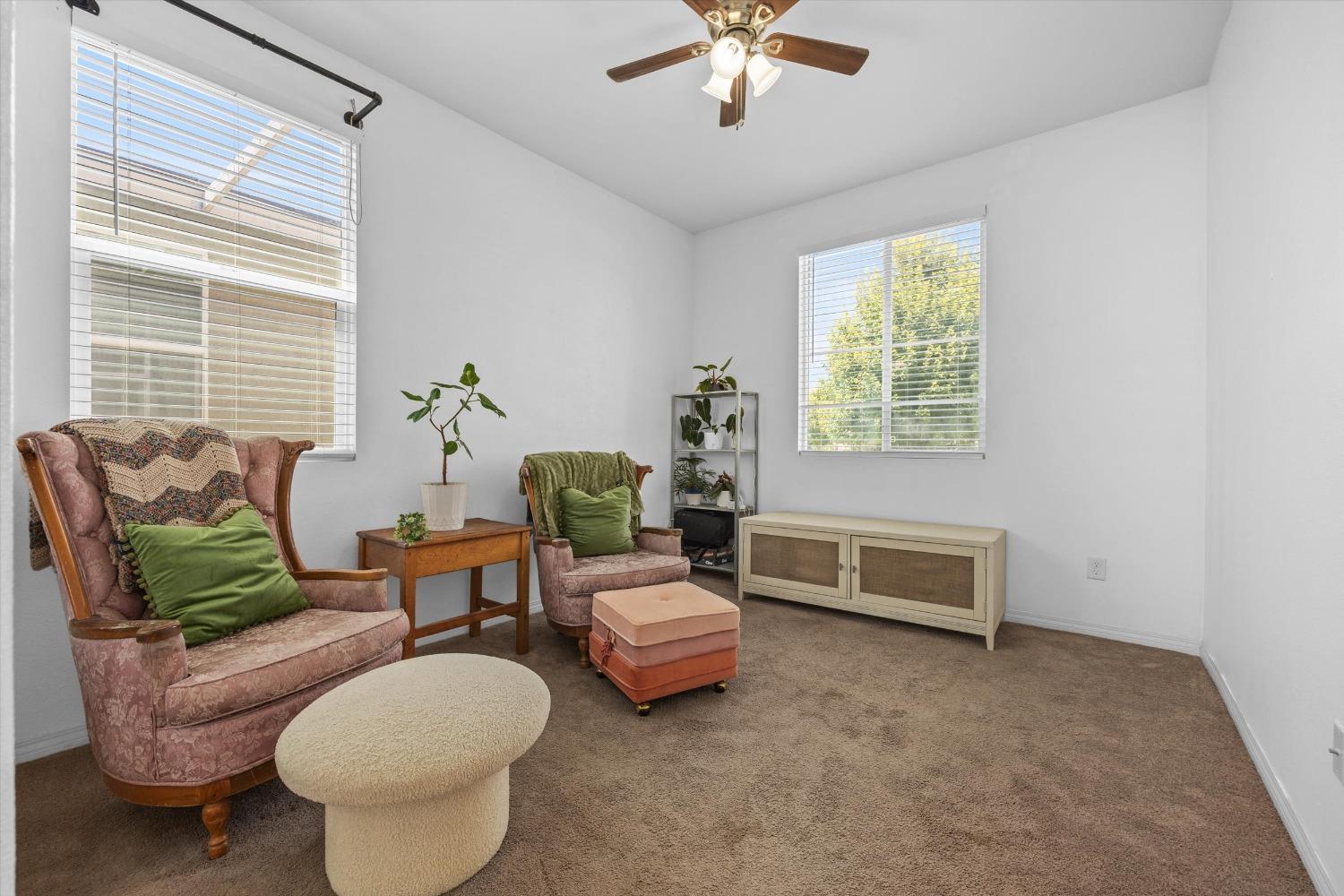 5407 Mensen Drive Bakersfield, CA 93313 - Photo 22 of 36 a living room with furniture and a window
