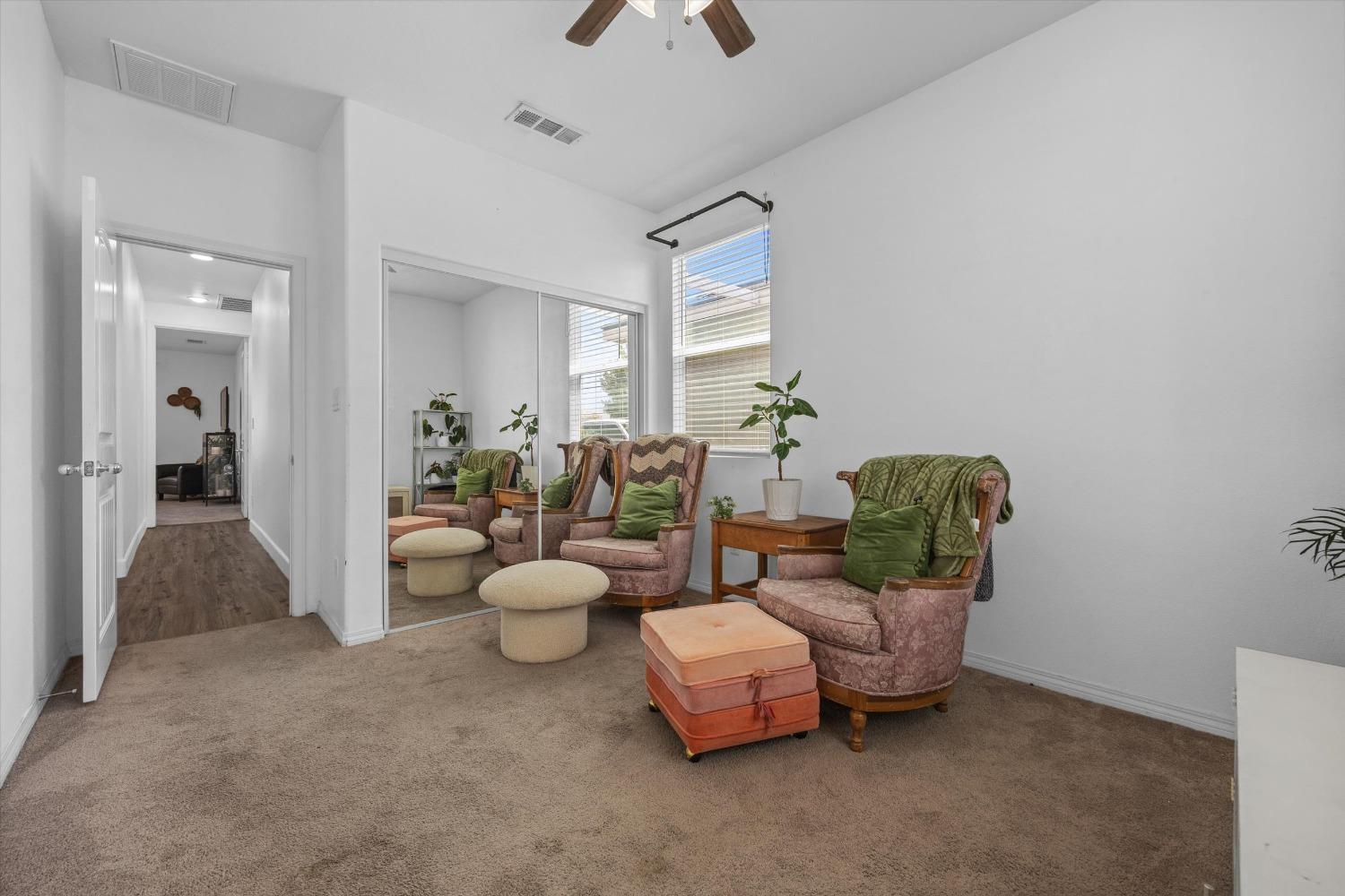 5407 Mensen Drive Bakersfield, CA 93313 - Photo 23 of 36 a living room with furniture and a chandelier