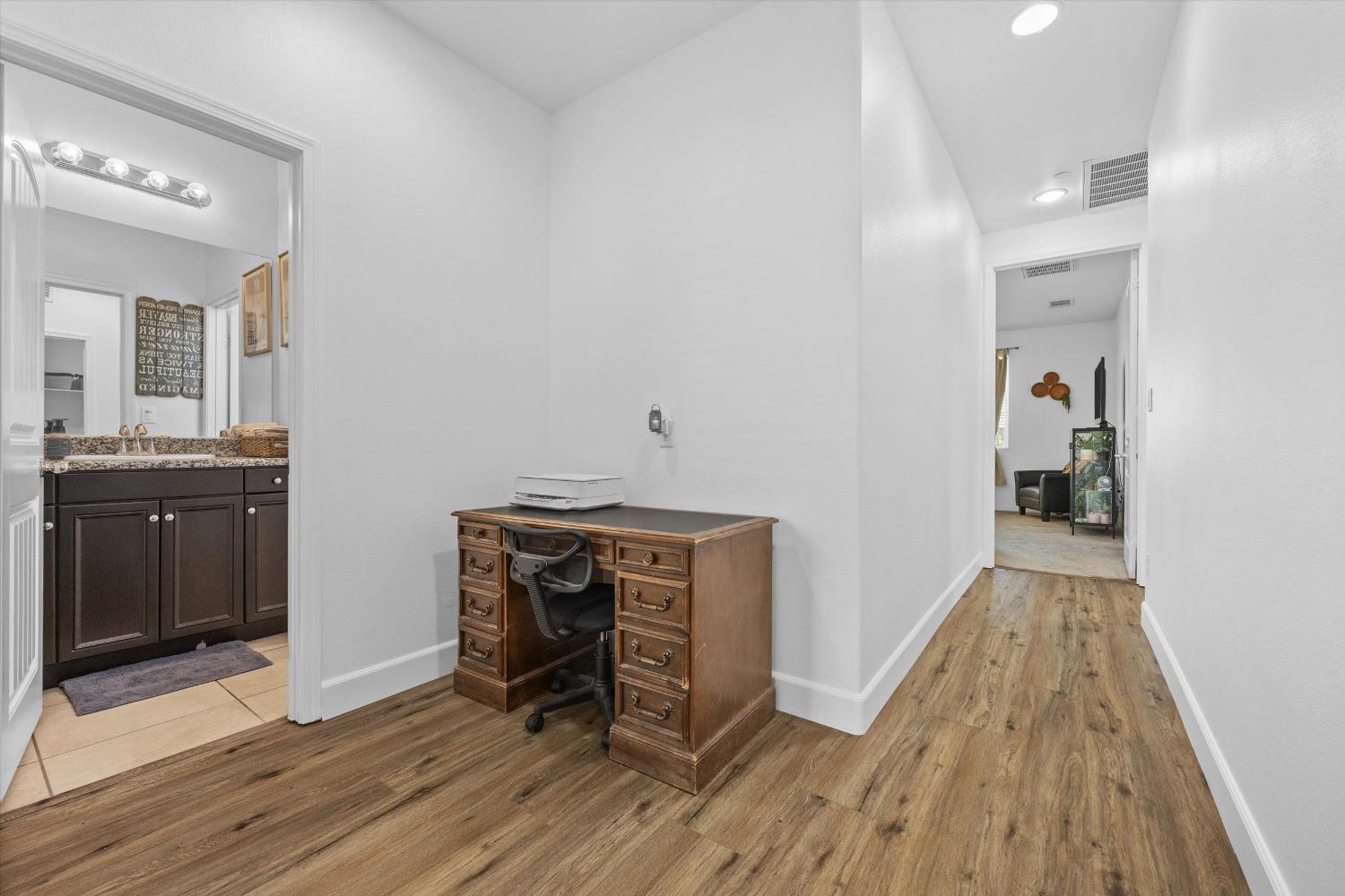 5407 Mensen Drive Bakersfield, CA 93313 - Photo 26 of 36 a view of a livingroom with wooden floor and furniture