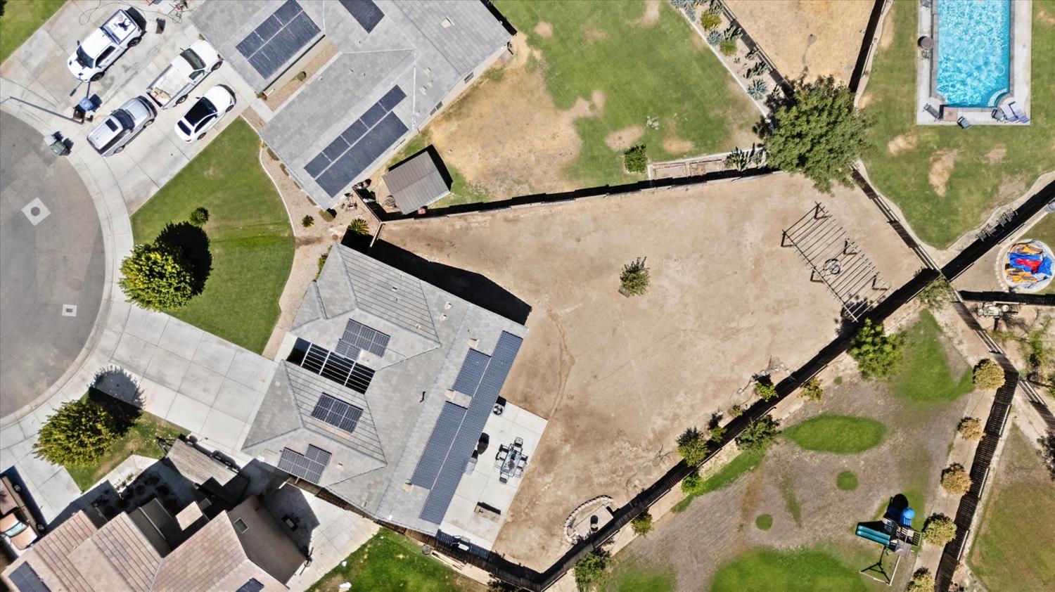 5407 Mensen Drive Bakersfield, CA 93313 - Photo 32 of 36 an aerial view of a house with a yard