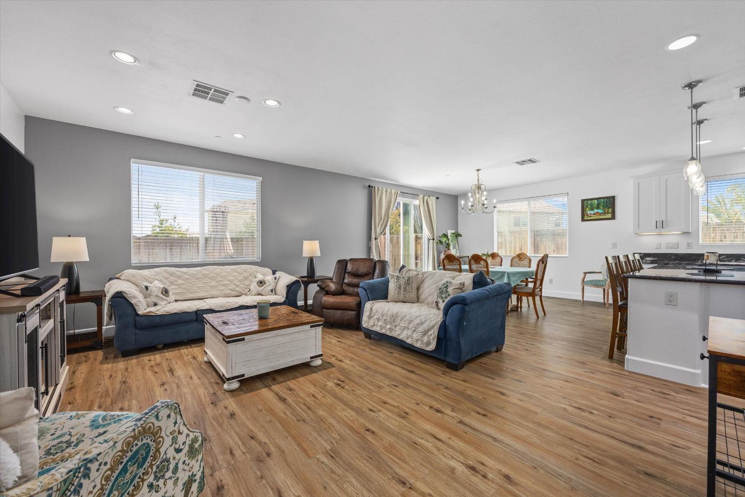 5407 Mensen Drive Bakersfield, CA 93313 - Photo 5 of 36 a living room with furniture and a wooden floor