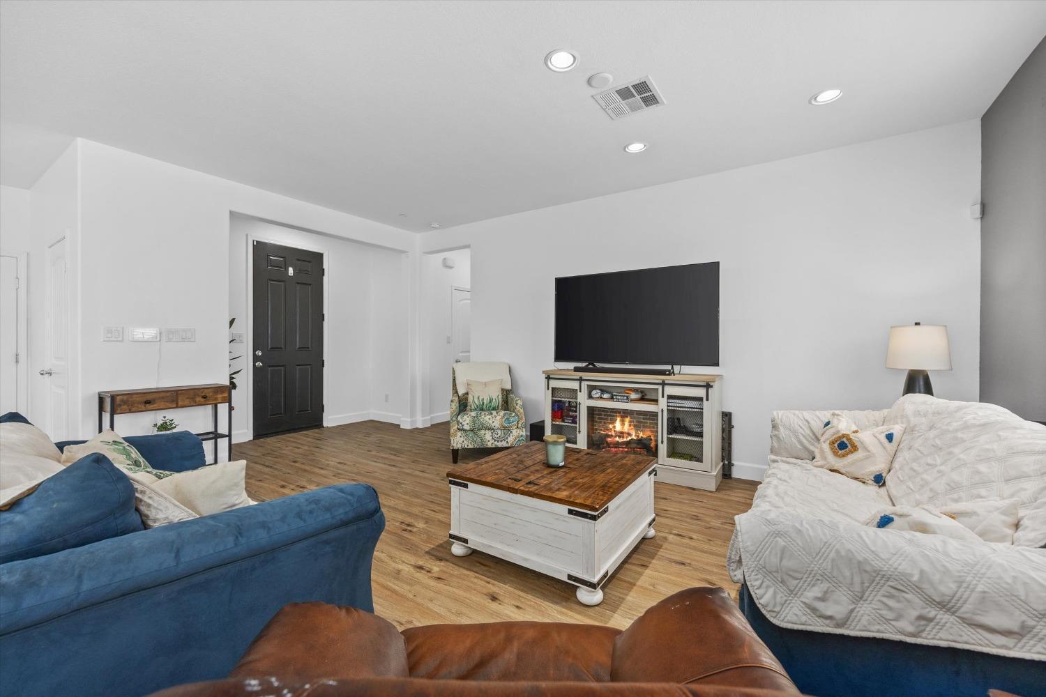 5407 Mensen Drive Bakersfield, CA 93313 - Photo 6 of 36 a living room with furniture and a flat screen tv