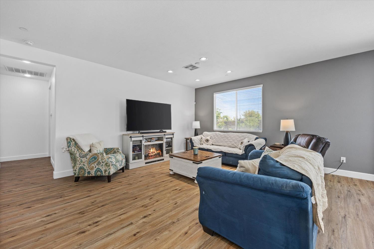 5407 Mensen Drive Bakersfield, CA 93313 - Photo 7 of 36 a living room with furniture and a flat screen tv