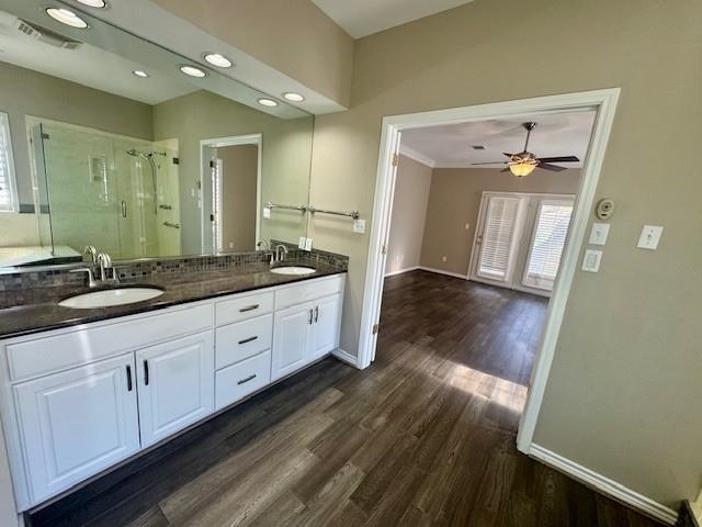 407 Quick Silver Horseshoe Bay, TX 78657 - Photo 21 of 31 a spacious bathroom with a granite countertop sink and a mirror