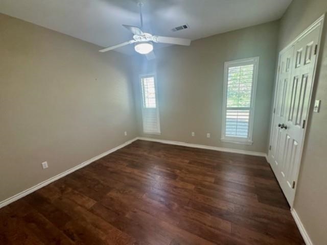 407 Quick Silver Horseshoe Bay, TX 78657 - Photo 23 of 31 an empty room with wooden floor and windows