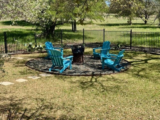 407 Quick Silver Horseshoe Bay, TX 78657 - Photo 29 of 31 a view of a lake with a bench and trees around