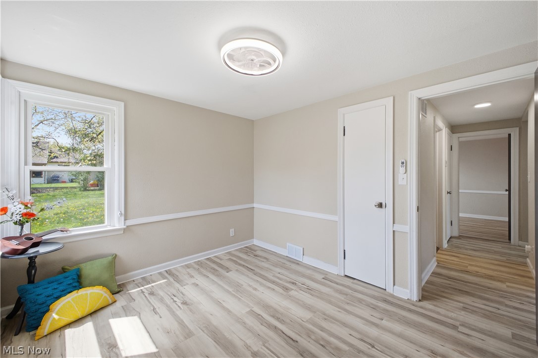 3232 Bears Den Road Youngstown, OH 44511 - Photo 18 of 38 Interior room featuring wood-finish flooring, light neutral-toned walls, and white trim