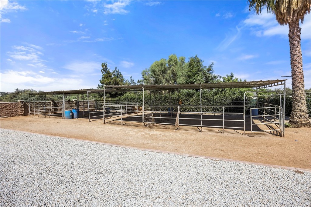 17411 Kaison Circle Riverside, CA 92508 - Photo 61 of 75 A combination of dirt, crushed rock/gravel and stamped concrete are in the rear of the property