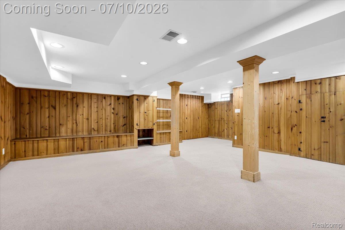 1336 Harvard Road Grosse Pointe, MI 48230 - Photo 42 of 73 The finished lower level provides a carpeted living area ideal for entertaining, while multiple dedicated storage rooms offer incredible functionality.