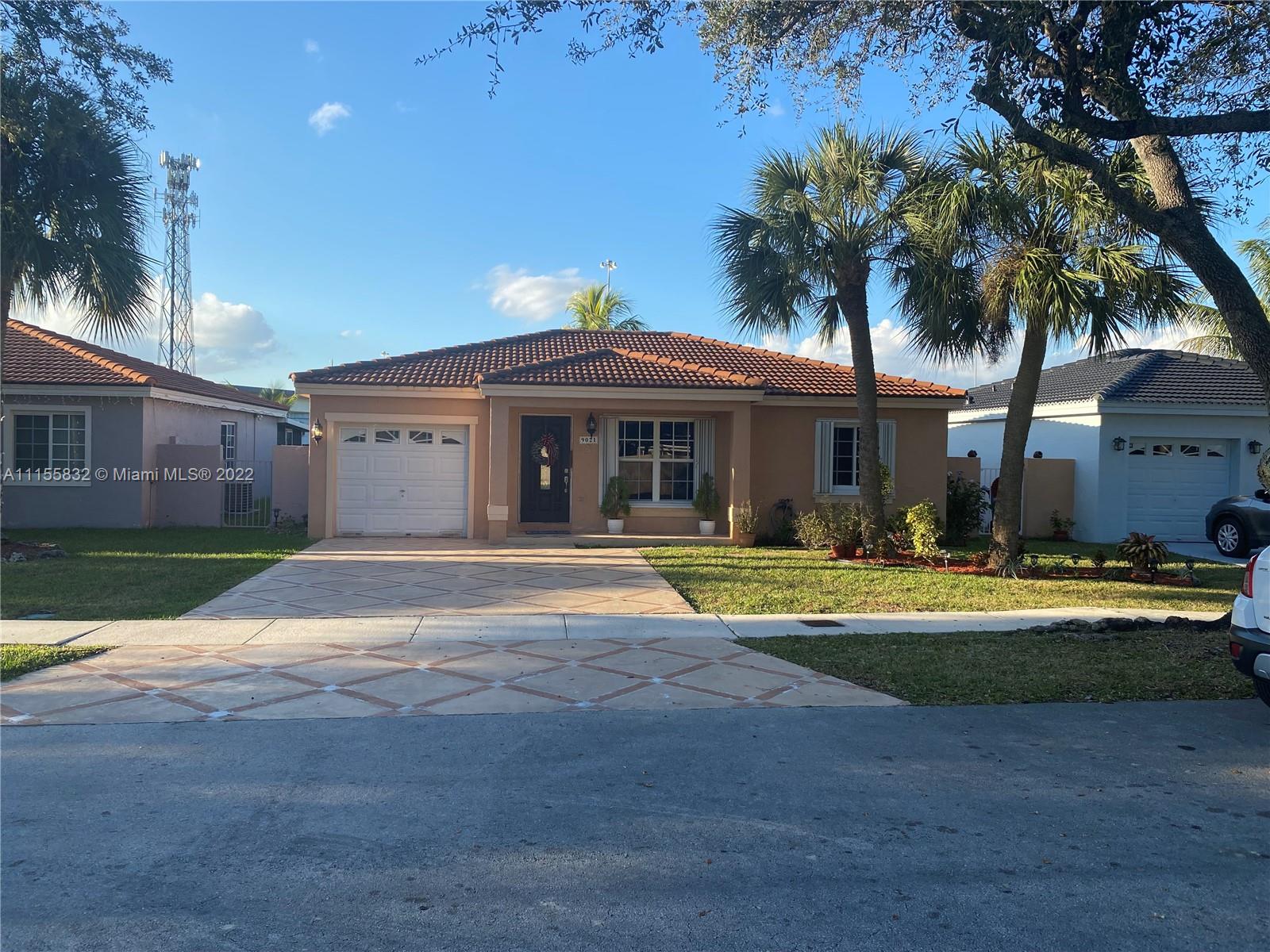 Lakes on the Green Hialeah, FL 33018 - Photo 1 of 24 a view of a house with swimming pool and a yard