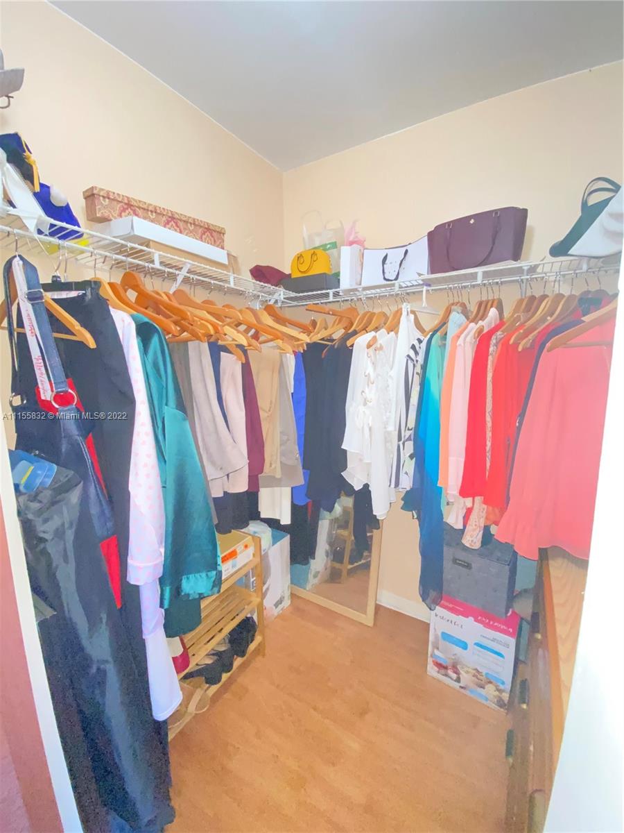 Lakes on the Green Hialeah, FL 33018 - Photo 15 of 24 a view of walk in closet with clothes