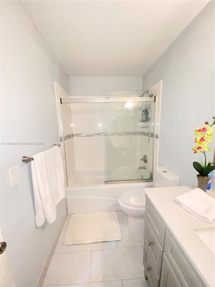 Lakes on the Green Hialeah, FL 33018 - Photo 17 of 24 a bathroom with a sink a toilet and shower