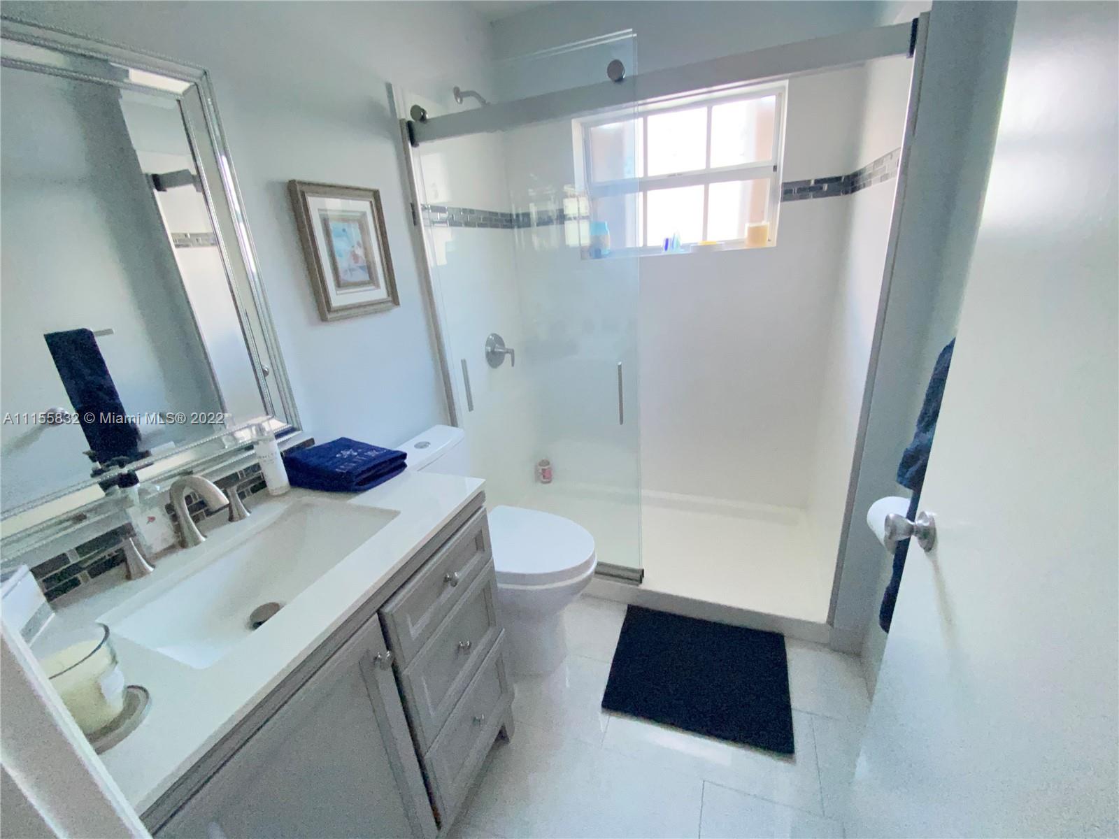 Lakes on the Green Hialeah, FL 33018 - Photo 20 of 24 a bathroom with a sink toilet and shower