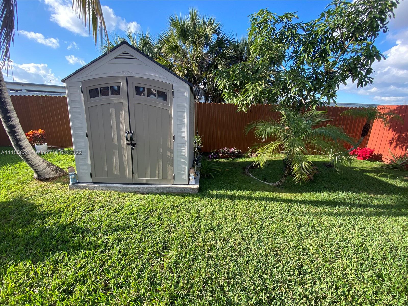 Lakes on the Green Hialeah, FL 33018 - Photo 24 of 24 a front view of a house with garden