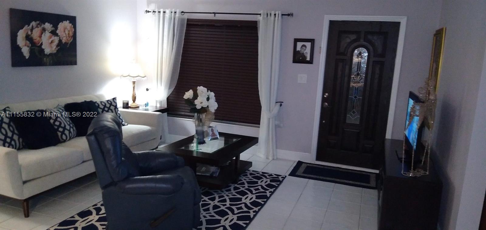 Lakes on the Green Hialeah, FL 33018 - Photo 3 of 24 a living room with furniture