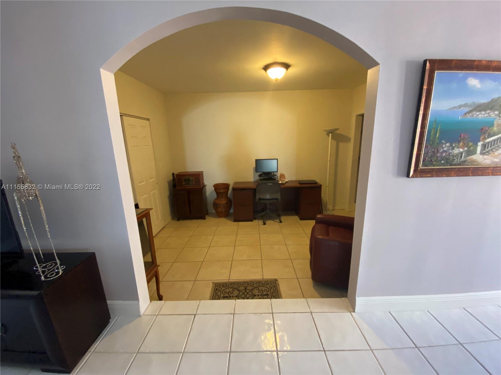 Lakes on the Green Hialeah, FL 33018 - Photo 7 of 24 a view of a livingroom with furniture and a flat screen tv