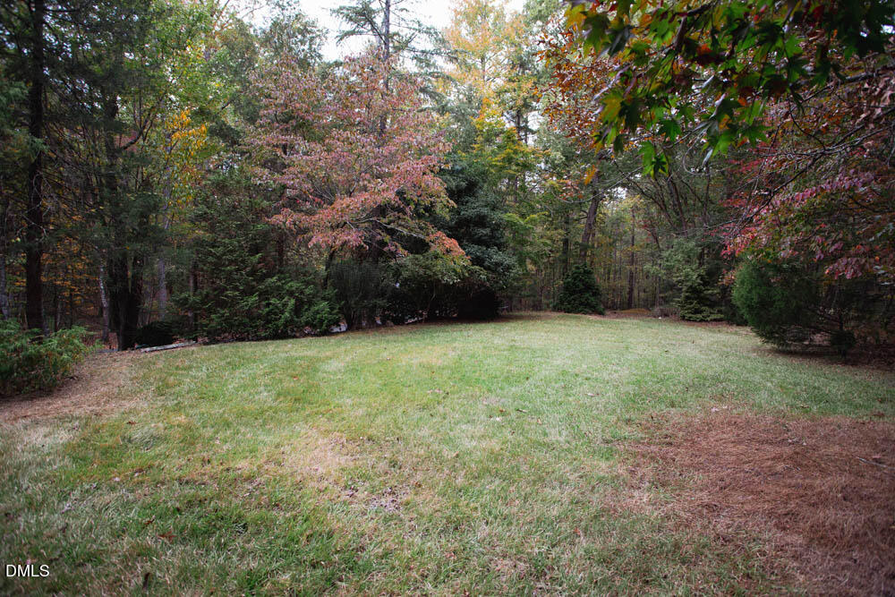 1921 Brassfield Road Raleigh, NC 27614 - Photo 15 of 28 a view of a yard with trees