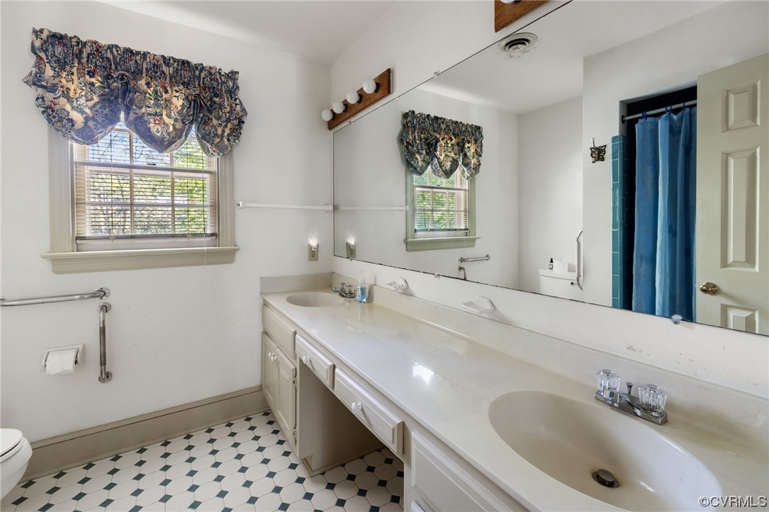 1806 Plain View Road Henrico, VA 23238 - Photo 25 of 33 a bathroom with a sink and a mirror