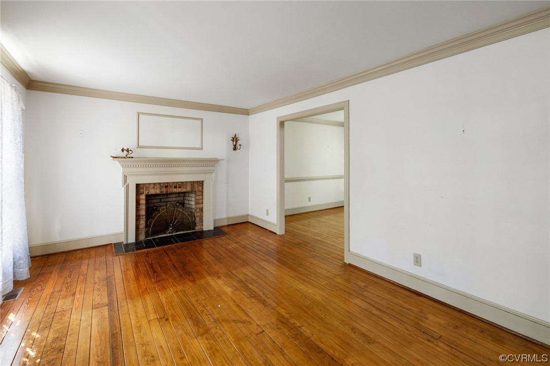 1806 Plain View Road Henrico, VA 23238 - Photo 6 of 33 a view of a livingroom with wooden floor and a fireplace
