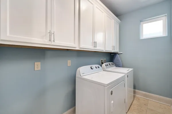 a bedroom with furniture and a window