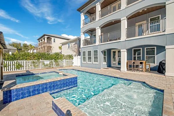 a view of a swimming pool with a patio