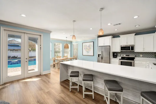 a dining room with furniture and window