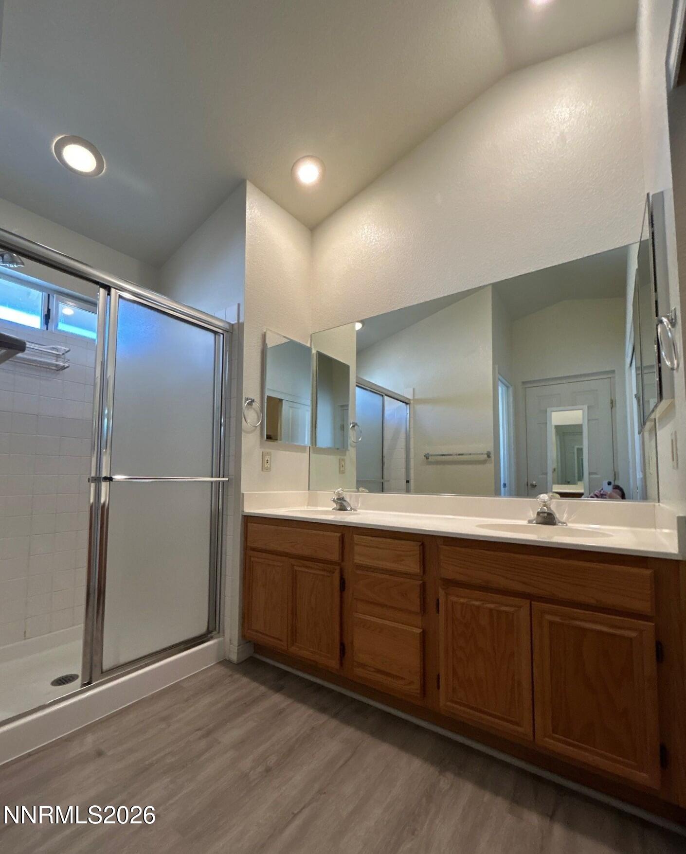 3951 Aspendale Drive Reno, NV 89503 - Photo 12 of 22 a bathroom with a double vanity sink and mirror