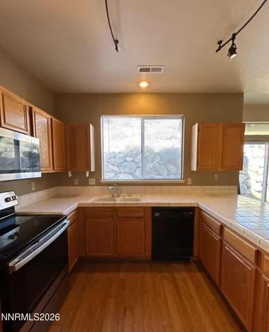 a bathroom with a sink a toilet a mirror and vanity